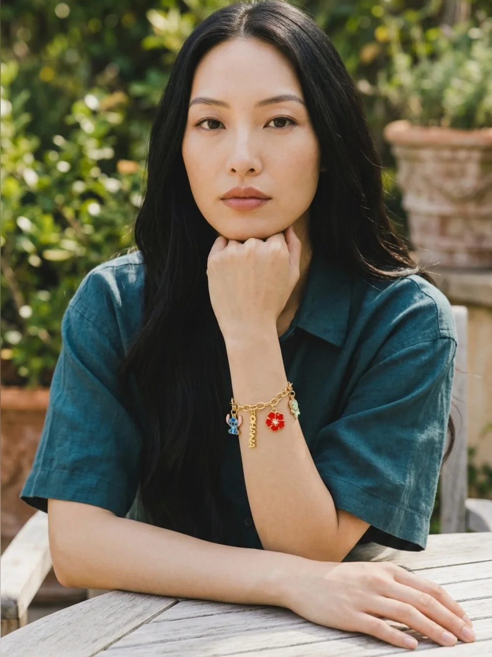 Gold Charm Bracelet with Blue Stitch and Red Flower Charms